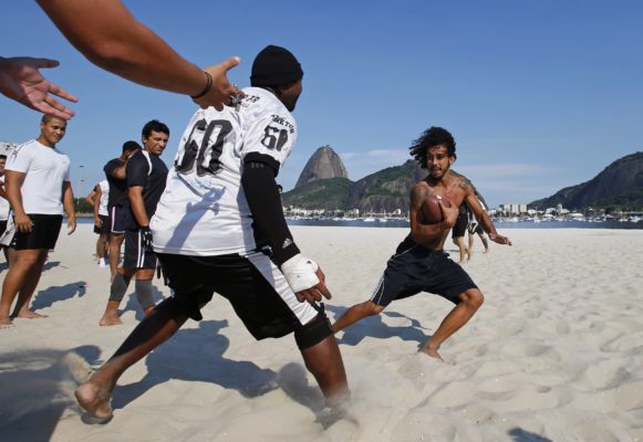 Botafogo Mamutes players play football during a training session on Botafogo beach in Rio de Janeiro