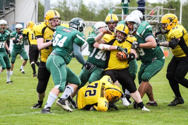 Trojans D gang tackle the ball carrier. Photo by Dave Bradshaw photography