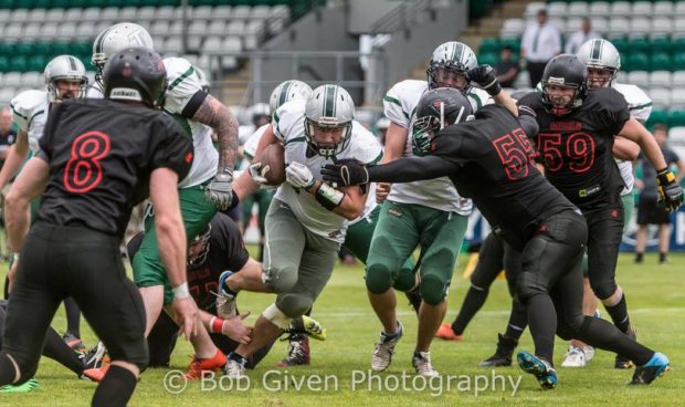 Full Back, Neil Montgomery storms through for the touchdown. Photography by Bob Given