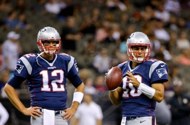 Aug 22, 2015; New Orleans, LA, USA; New England Patriots quarterback Tom Brady (12) and quarterback Jimmy Garoppolo (10) prior to a preseason game against the New Orleans Saints the at Mercedes-Benz Superdome. Mandatory Credit: Derick E. Hingle-USA TODAY Sports