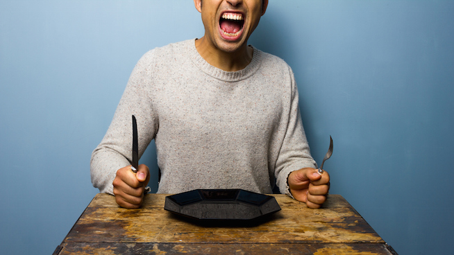 Hungry young man is screaming for his dinner