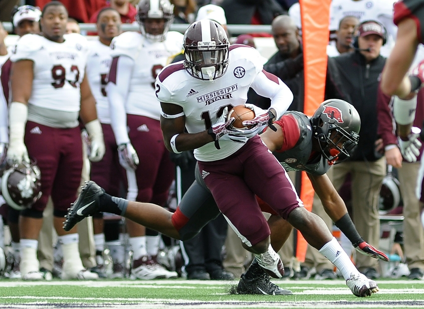 Nov 23, 2013; Little Rock, AR, USA; Mississippi State Bulldogs wide receiver Robert Johnson (12) carries the ball against the Arkansas Razorbacks during the second quarter at War Memorial Stadium. Mandatory Credit: Justin Ford-USA TODAY Sports